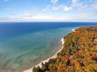 Discover the charm and serenity of lakeside living in this newly on Harbor Point Golf Club in Michigan - for sale on GolfHomes.com, golf home, golf lot