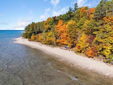 Discover the charm and serenity of lakeside living in this newly on Harbor Point Golf Club in Michigan - for sale on GolfHomes.com, golf home, golf lot