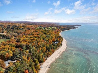 Discover the charm and serenity of lakeside living in this newly on Harbor Point Golf Club in Michigan - for sale on GolfHomes.com, golf home, golf lot