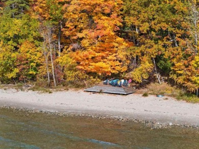 Discover the charm and serenity of lakeside living in this newly on Harbor Point Golf Club in Michigan - for sale on GolfHomes.com, golf home, golf lot