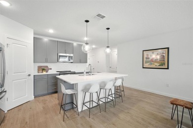 Discover the perfect blend of elegance, comfort, and private on The Grand Club - Pine Lakes Course in Florida - for sale on GolfHomes.com, golf home, golf lot