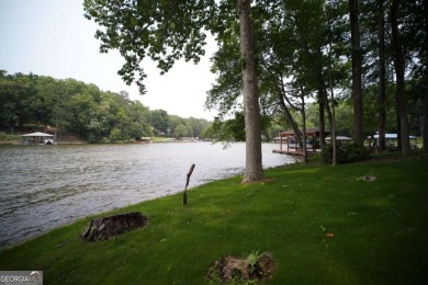 Dive into lakeside luxury at its finest in the heart of Turtle on Turtle Cove Golf Course in Georgia - for sale on GolfHomes.com, golf home, golf lot