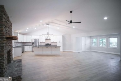 Dive into lakeside luxury at its finest in the heart of Turtle on Turtle Cove Golf Course in Georgia - for sale on GolfHomes.com, golf home, golf lot
