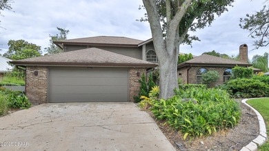 Contemporary, two story brick home has elegance and style on Spruce Creek Golf Club in Florida - for sale on GolfHomes.com, golf home, golf lot