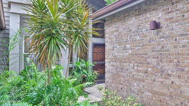 Contemporary, two story brick home has elegance and style on Spruce Creek Golf Club in Florida - for sale on GolfHomes.com, golf home, golf lot