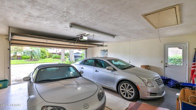 Contemporary, two story brick home has elegance and style on Spruce Creek Golf Club in Florida - for sale on GolfHomes.com, golf home, golf lot