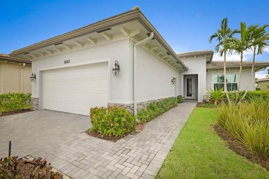 This 2022 built home sits on the preserve with incredible views on Ibis Golf and Country Club in Florida - for sale on GolfHomes.com, golf home, golf lot