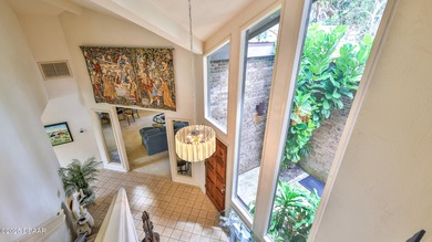 Contemporary, two story brick home has elegance and style on Spruce Creek Golf Club in Florida - for sale on GolfHomes.com, golf home, golf lot