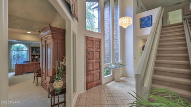 Contemporary, two story brick home has elegance and style on Spruce Creek Golf Club in Florida - for sale on GolfHomes.com, golf home, golf lot