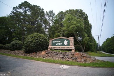 Dive into lakeside luxury at its finest in the heart of Turtle on Turtle Cove Golf Course in Georgia - for sale on GolfHomes.com, golf home, golf lot