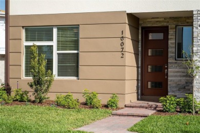 Stunning Move-In Ready Townhome in the Prestigious Gated on Eagle Creek Golf Club in Florida - for sale on GolfHomes.com, golf home, golf lot