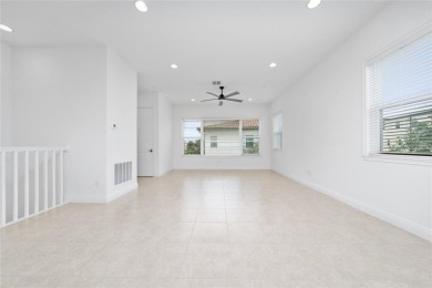 Stunning Move-In Ready Townhome in the Prestigious Gated on Eagle Creek Golf Club in Florida - for sale on GolfHomes.com, golf home, golf lot