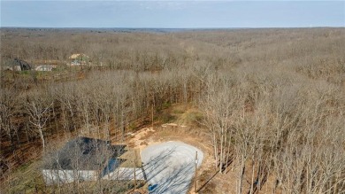 Discover the natural beauty of this 4.31-acre property, located on Bella Vista - Metfield Golf Complex and Country Club in Arkansas - for sale on GolfHomes.com, golf home, golf lot
