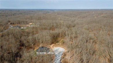 Discover the natural beauty of this 4.31-acre property, located on Bella Vista - Metfield Golf Complex and Country Club in Arkansas - for sale on GolfHomes.com, golf home, golf lot