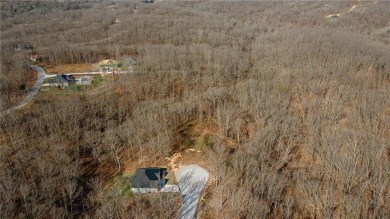 Discover the natural beauty of this 4.31-acre property, located on Bella Vista - Metfield Golf Complex and Country Club in Arkansas - for sale on GolfHomes.com, golf home, golf lot