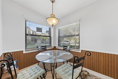 MAJOR PRICE IMPROVEMENT! WILL NOT LAST ...Beautifully maintained on Woodmont Country Club in Florida - for sale on GolfHomes.com, golf home, golf lot