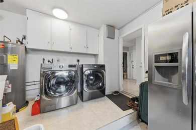 MAJOR PRICE IMPROVEMENT! WILL NOT LAST ...Beautifully maintained on Woodmont Country Club in Florida - for sale on GolfHomes.com, golf home, golf lot