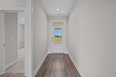 The Coventry welcomes you home. This newly-constructed 3-bedroom on Carolina Colours Golf Club in North Carolina - for sale on GolfHomes.com, golf home, golf lot