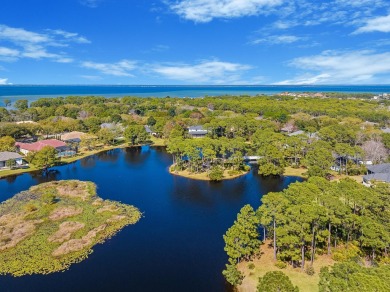 Prime Golf Course and waterfront home overlooking one of on Kelly Plantation Golf Club in Florida - for sale on GolfHomes.com, golf home, golf lot