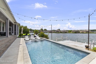 Welcome to 121 Camden Lane - a dreamy waterfront retreat!  This on Lake Caroline Golf Club in Mississippi - for sale on GolfHomes.com, golf home, golf lot