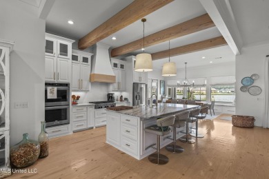 Welcome to 121 Camden Lane - a dreamy waterfront retreat!  This on Lake Caroline Golf Club in Mississippi - for sale on GolfHomes.com, golf home, golf lot