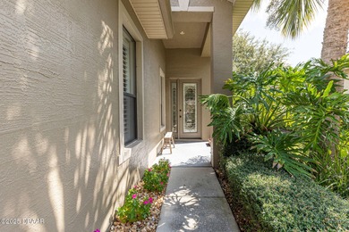 This 2 bed 2 bath + Bonus room, single-story end-unit townhome on Plantation Bay Golf and Country Club in Florida - for sale on GolfHomes.com, golf home, golf lot