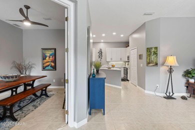 This 2 bed 2 bath + Bonus room, single-story end-unit townhome on Plantation Bay Golf and Country Club in Florida - for sale on GolfHomes.com, golf home, golf lot
