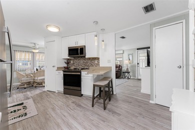 Totally updated, upgraded 2 bed/2 bath manufactured home on on Sabal Trace Golf and Country Club in Florida - for sale on GolfHomes.com, golf home, golf lot