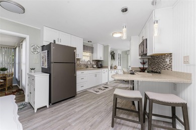 Totally updated, upgraded 2 bed/2 bath manufactured home on on Sabal Trace Golf and Country Club in Florida - for sale on GolfHomes.com, golf home, golf lot