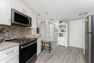 Totally updated, upgraded 2 bed/2 bath manufactured home on on Sabal Trace Golf and Country Club in Florida - for sale on GolfHomes.com, golf home, golf lot