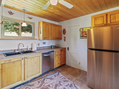 Welcome to The Great Escape, a desirable 3BR/2BA alpine home on El Valle Escondido Golf Course in New Mexico - for sale on GolfHomes.com, golf home, golf lot