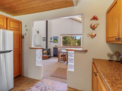 Welcome to The Great Escape, a desirable 3BR/2BA alpine home on El Valle Escondido Golf Course in New Mexico - for sale on GolfHomes.com, golf home, golf lot