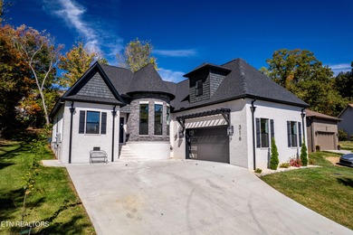 Tucked away on a peaceful cul-de-sac in Tellico Village's on Toqua Golf Course - Loudon County in Tennessee - for sale on GolfHomes.com, golf home, golf lot