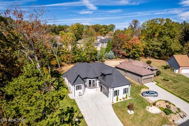 Tucked away on a peaceful cul-de-sac in Tellico Village's on Toqua Golf Course - Loudon County in Tennessee - for sale on GolfHomes.com, golf home, golf lot