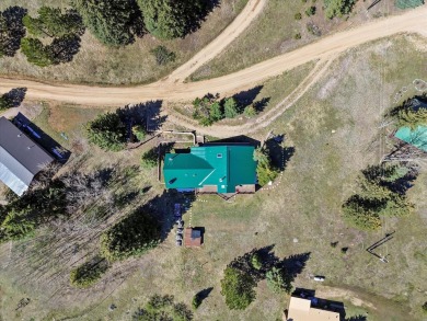 Welcome to The Great Escape, a desirable 3BR/2BA alpine home on El Valle Escondido Golf Course in New Mexico - for sale on GolfHomes.com, golf home, golf lot