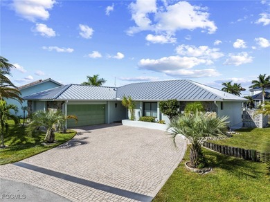 Discover this inviting 3 bedroom, 2 bathroom canalfront home in on Saint Andrews South Golf Club in Florida - for sale on GolfHomes.com, golf home, golf lot