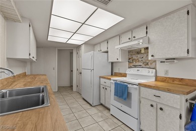 Discover this inviting 3 bedroom, 2 bathroom canalfront home in on Saint Andrews South Golf Club in Florida - for sale on GolfHomes.com, golf home, golf lot