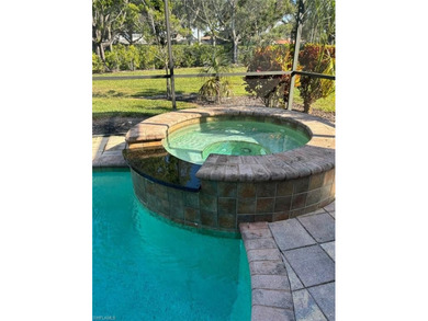 HEATED POOL & SPA WITH CASCADING WATERFALL! Welcome to Belle on Estero Country Club in Florida - for sale on GolfHomes.com, golf home, golf lot