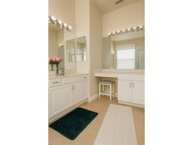 HEATED POOL & SPA WITH CASCADING WATERFALL! Welcome to Belle on Estero Country Club in Florida - for sale on GolfHomes.com, golf home, golf lot