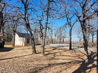 Beautiful corner lot build site with lake views and mature oak on Nocona Hills Golf Course in Texas - for sale on GolfHomes.com, golf home, golf lot