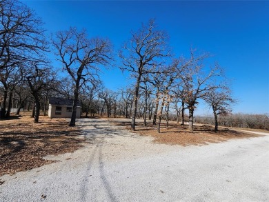 Beautiful corner lot build site with lake views and mature oak on Nocona Hills Golf Course in Texas - for sale on GolfHomes.com, golf home, golf lot