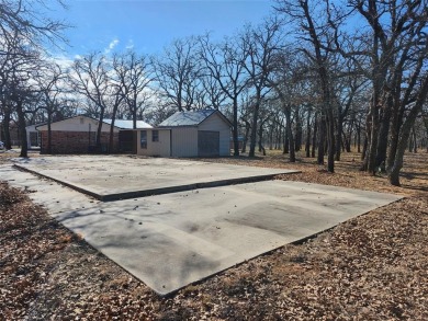 Beautiful corner lot build site with lake views and mature oak on Nocona Hills Golf Course in Texas - for sale on GolfHomes.com, golf home, golf lot