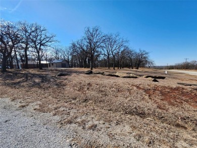 Beautiful corner lot build site with lake views and mature oak on Nocona Hills Golf Course in Texas - for sale on GolfHomes.com, golf home, golf lot