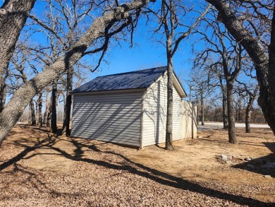 Beautiful corner lot build site with lake views and mature oak on Nocona Hills Golf Course in Texas - for sale on GolfHomes.com, golf home, golf lot