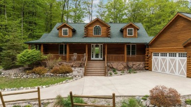 Stunning, custom-built log home overlooking the 16th tee & on Cedar River Golf Course in Michigan - for sale on GolfHomes.com, golf home, golf lot