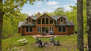 Stunning, custom-built log home overlooking the 16th tee & on Cedar River Golf Course in Michigan - for sale on GolfHomes.com, golf home, golf lot