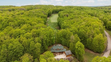 Stunning, custom-built log home overlooking the 16th tee & on Cedar River Golf Course in Michigan - for sale on GolfHomes.com, golf home, golf lot