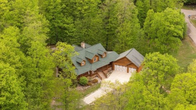 Stunning, custom-built log home overlooking the 16th tee & on Cedar River Golf Course in Michigan - for sale on GolfHomes.com, golf home, golf lot