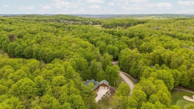 Stunning, custom-built log home overlooking the 16th tee & on Cedar River Golf Course in Michigan - for sale on GolfHomes.com, golf home, golf lot