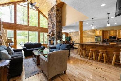 Stunning, custom-built log home overlooking the 16th tee & on Cedar River Golf Course in Michigan - for sale on GolfHomes.com, golf home, golf lot